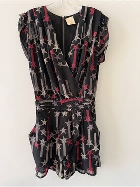 Women’s romper by Line & Dot black w/ red & cream star print.